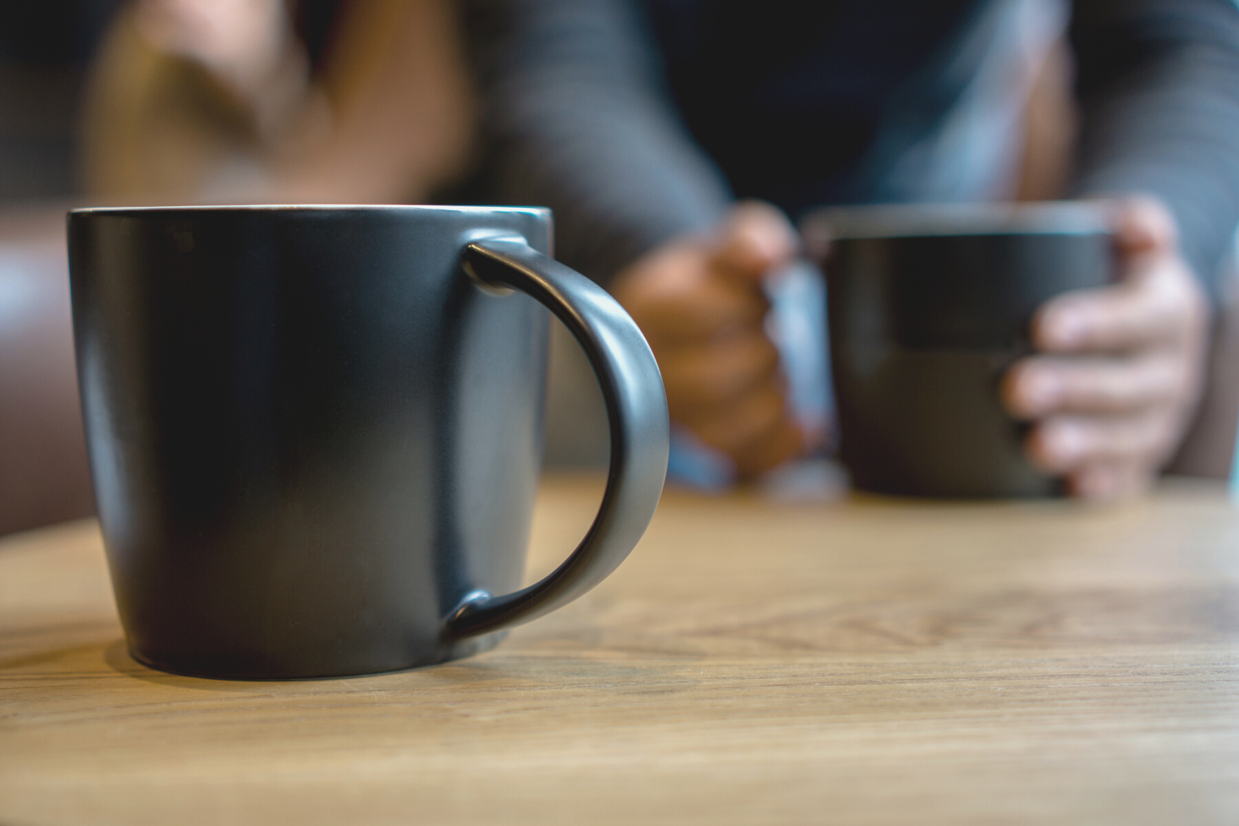 black coffee cup on table, chatting and dating